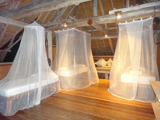 Resort villa with bed canopies and soft furnishings fitted by Hong Heng.