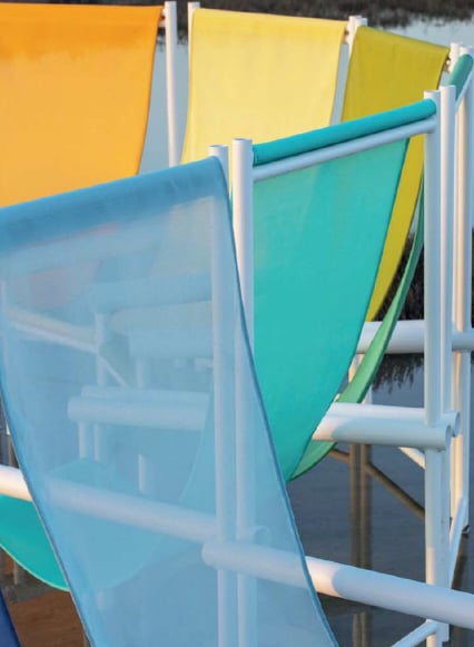 Sling mesh fabrics in a range of colours on outdoor chair frames.